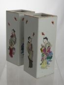 A Pair of Chinese Wu Shang Pu Pillar Vases. The Famille rose vases hand painted with bats and