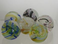 Six Caithness Glass Paperweights, including 'Ribbon Multi' Pink, Green and Blue, Yellow Blue, Yellow