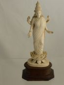 An Antique Indian Carved Figure of Laksmi, approx ht of figure 21 cms, the figure standing on an