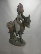 A  Lladro Figure of a Young Girl on a Donkey, impressed marks to base 5465 E-12 JU, 20 cms high.