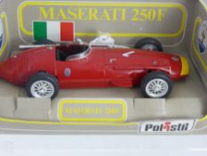 A 1 : Scale Die Cast Model of a 1950's Red Maserati 250F Racing Car by Polistil.