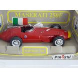 A 1 : Scale Die Cast Model of a 1950's Red Maserati 250F Racing Car by Polistil.