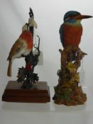 Two Figurines of Birds, including a Robin seated on a Holly bush and a King Fisher with