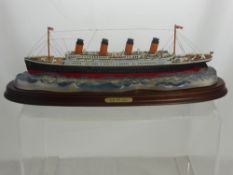 A Hand Painted Replica of White Star Lines 'Titanic' Liner, No. 6562 on a stand.