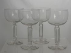 A Collection of Four Art Deco Champagne Glasses, together with four glass stirrup glasses.