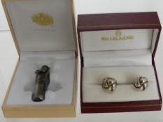 A Pair of Silver Gentleman's Cuff Links, in the form of knots and a cigar piercer stamped Avo