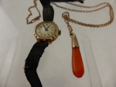 A 9ct Gold Cornelian Pendant and a 9ct Gold Chain together with a 9 ct gold cocktail watch.