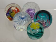 Four Caithness Glass Paper Weights, including 'Buttercup', 'I Spy', 'Sub', 'Festival' and '