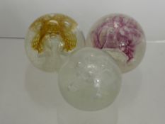 Three Caithness Glass Paperweights, including 'Congratulations' of Beige,Pink and White.