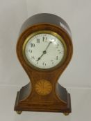 An Edwardian Mahogany Inlaid Mantel Clock, the clock having white enamel face on ball feet,