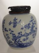 An Antique Chinese Blue and White Ginger Jar, the jar having a painted frieze depicting cherry