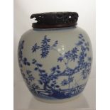 An Antique Chinese Blue and White Ginger Jar, the jar having a painted frieze depicting cherry