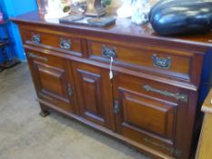 A Mahogany Arts and Crafts Style Sideboard, the sideboard having two drawers with cupboards under