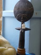 An Ebony Statuette believed to be a tribal fertility goddess, 57 cms high.