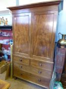 A Victorian Mahogany Linen Press, the linen press having two short drawers and two long under. On