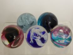 Five Caithness Glass Paper Weights, including 'Water Colours', Scimitar', 'Momentum', 'Snow Trail'