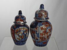 Two Japanese Imari Lidded Vases, with acorns to the lids, approx 22 and 18 cms