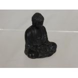 A Metal Figure of a Seated Buddha with character marks to base approx. 8.5 cms.