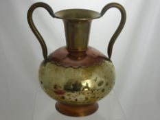 A Brass and Copper Two Handled Vase, 36 cm ht, together with two brass table lights.