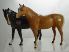 A Beswick Figure of a Standing Palomino Horse, together with one other Chestnut Beswick horse. (2)