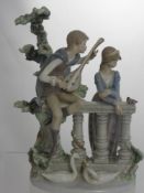 A Lladro Special Edition Piece depicting a minstrel and his muse resting on a bridge with swans