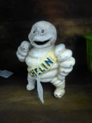 An Cast Iron Figurine of 'The Michelin Man' Moneybox inscription on reverse reads Reg 7548/Detroit