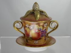 D. Winter - A Royal Worcester Twin Handled Lidded Cup and Saucer. The cup hand painted with fruit