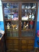 An Edwardian Oak Glass Fronted Display Cabinet, the interior fitted with three shelves and two