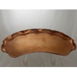 An Art Nouveau Newlyn Style Copper Tray, with hammered finish and decorative floral design.