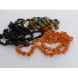 Three Beaded Necklaces, including a Black Murano style necklace, a Cornelian effect stone necklace