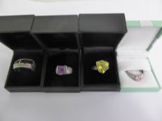 A Collection of Miscellaneous 925 Silver Rings, including amethyst, red and pink stone (4).