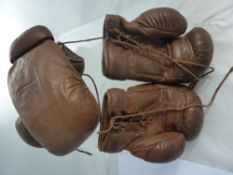 Two Pairs of Vintage Leather Boxing Gloves.