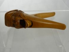 An Antique Continental Fruit wood Nutcracker, in the form of a jolly fellow.