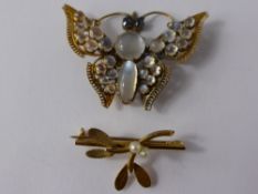 A Gold Metal and Moonstone Brooch, in the form of a butterfly together with a gold an pearl