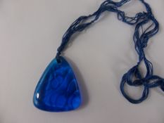 A 1920's Lalique Blue Glass Pendant, the triangular pendant depicting fruit and signed LALIQUE