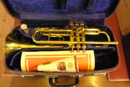 A Brass "Lark" Trumpet in the original case.