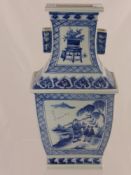 A Blue and White Chinese Vase, the vase in step form depicting characters fishing, with character