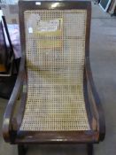 A Victorian Rosewood American Style Rattan Seated Porch Chair, the chair having one left arm with