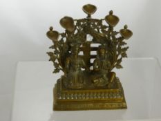 An Antique  brass handle study depicting a Hindu couple in praying position on a square step