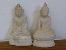Two Antique Marble Carvings depicting Buddha, seated on a lotus base in contemplative posture,