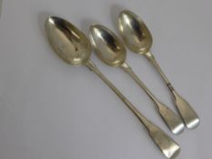 A Silver Georgian Basting Spoon, London hallmark 1808 together with two Victorian silver tablespoons