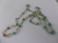 Circa 1920's Turquoise and Seed Pearl Graduated Necklace, the necklace on an 18 ct white gold and