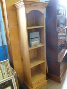 A Pine Book Shelf, the book shelf having four shelves with drawer under, 54 x 35 x 183 cms.