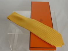 A Yellow Silk Hermes Gentleman's Tie, boxed.