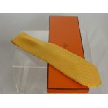 A Yellow Silk Hermes Gentleman's Tie, boxed.