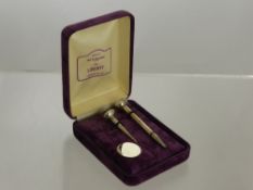 A Solid Silver Liberty of London set of golf tees in original box.