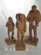 A Miscellaneous Collection of Figurines, including four hand carved wooden figures depicting various