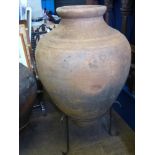 A Large Vintage Terracotta Portuguese Olive Oil Amphora on stand, height of vessel 106 cms 230 cms