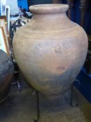 A Large Vintage Terracotta Portuguese Olive Oil Amphora on stand, height of vessel 106 cms 230 cms