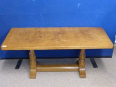 A Robert "Mouseman" Thompson of Kilburn Coffee Table, the table with adzed top, on carved supports